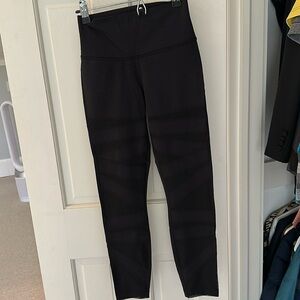 Lululemon yoga pants - mesh cut outs up the front. Never been worn.
